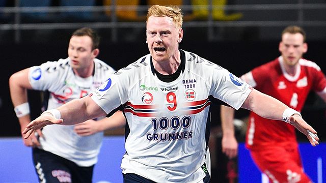 Norway's pivot Henrik Jakobsen (C) celebrates after scoring  during the 2021 World Men's Handball Championship match between Group E teams Switzerland and Norway at the 6th of October Sports Hall in 6th of October city, a suburb of the Egyptian capital Cairo on January 16, 2021. (Photo by Anne-Christine POUJOULAT / various sources / AFP)